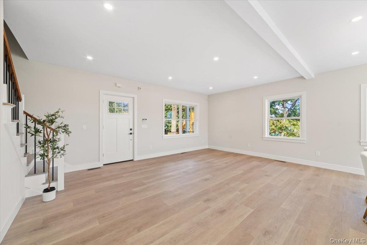 395 5th Avenue New Rochelle, NY 10801 - Photo 7 of 26 wooden floor in an empty room with a window