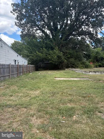 a view of outdoor space with swimming pool and trees