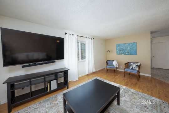 314 Lenore Street Ridgecrest, CA 93555 - Photo 11 of 29 a living room with furniture and a flat screen tv