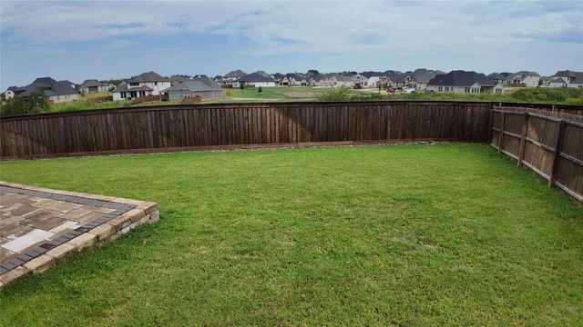 a view of a backyard with a garden and lake