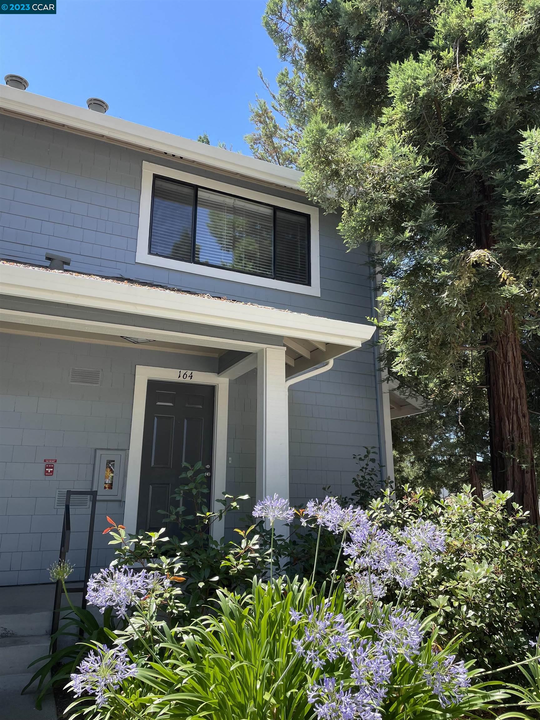 2687 Oak Road, Unit 164 Walnut Creek, CA 94597 - Photo 1 of 1 front view of a house with a yard