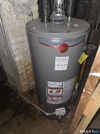 a bedroom with a bed and a fireplace