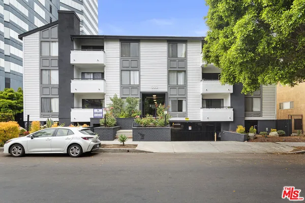 a view of a cars parked in front of a building