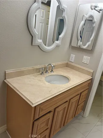 a bathroom with a sink and mirror