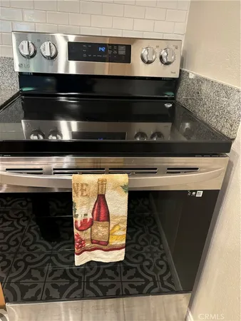 a stove top oven sitting inside of a kitchen