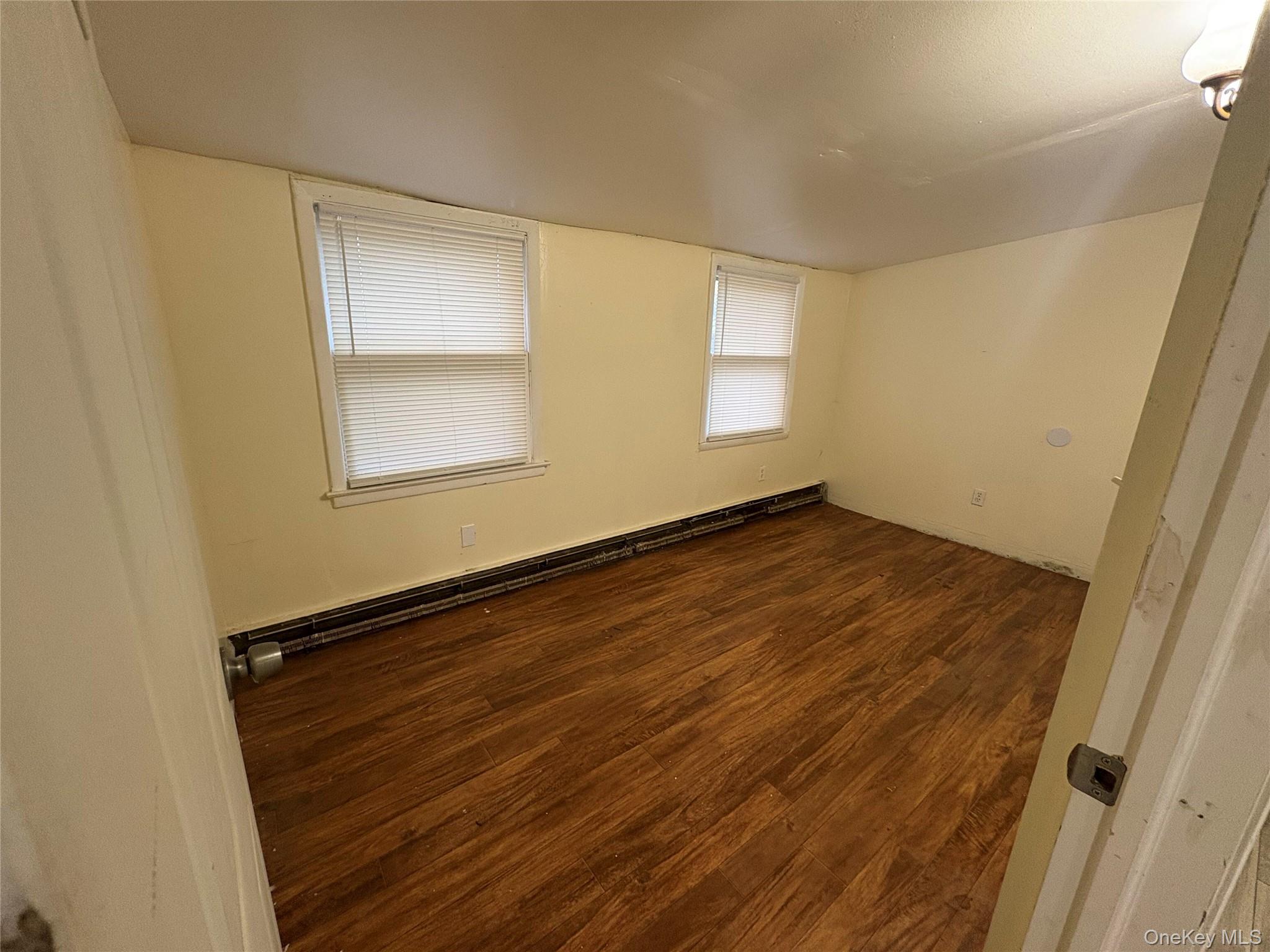 11 Old Turnpike Road Bloomingburg, NY 12721 - Photo 8 of 9 an empty room with wooden floor and windows