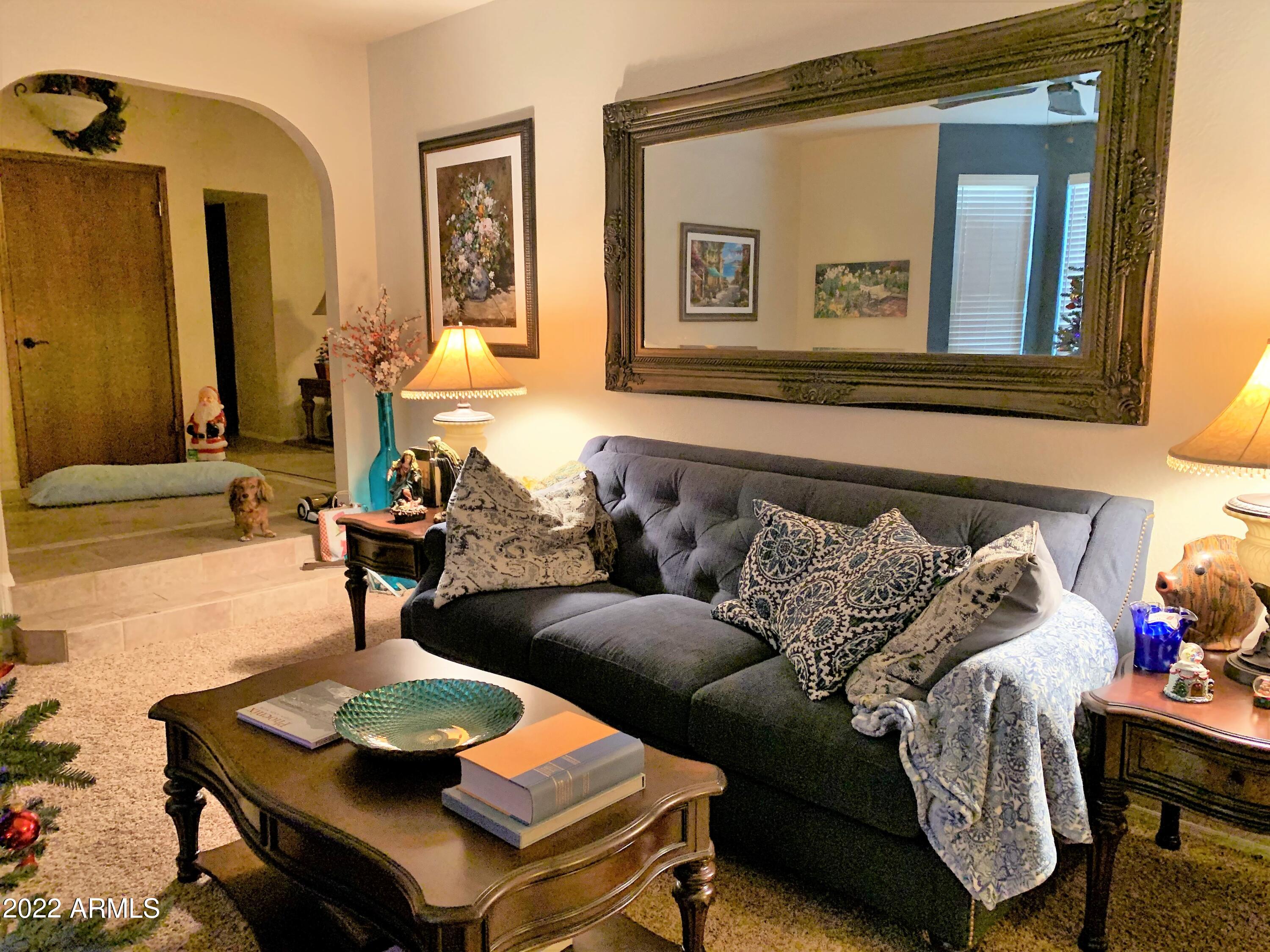 16502 West Magnolia Street Goodyear, AZ 85338 - Photo 11 of 59 a living room with furniture and a mirror