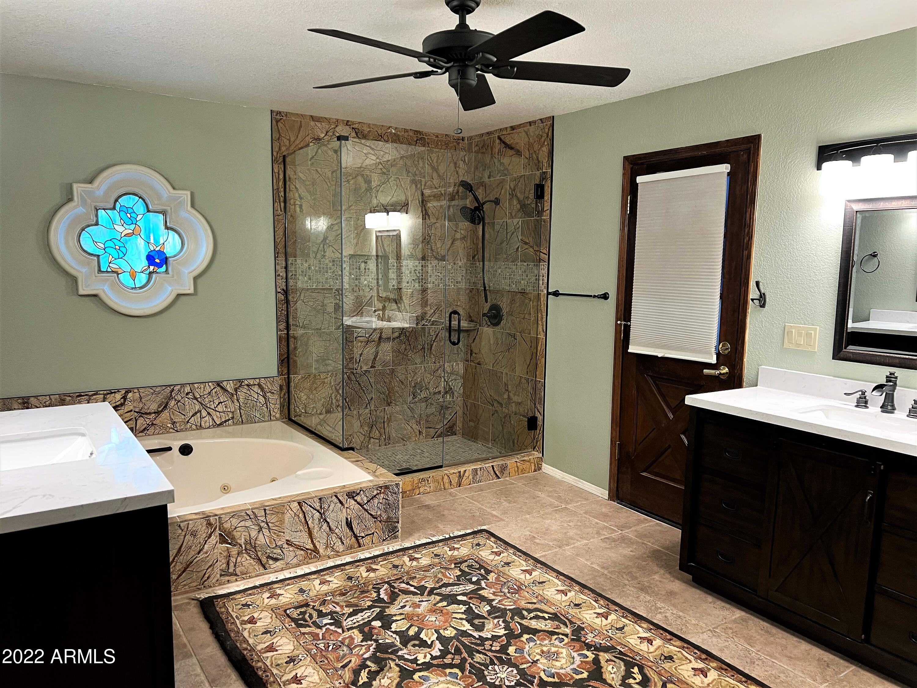 16502 West Magnolia Street Goodyear, AZ 85338 - Photo 24 of 59 a bathroom with a sink and a mirror