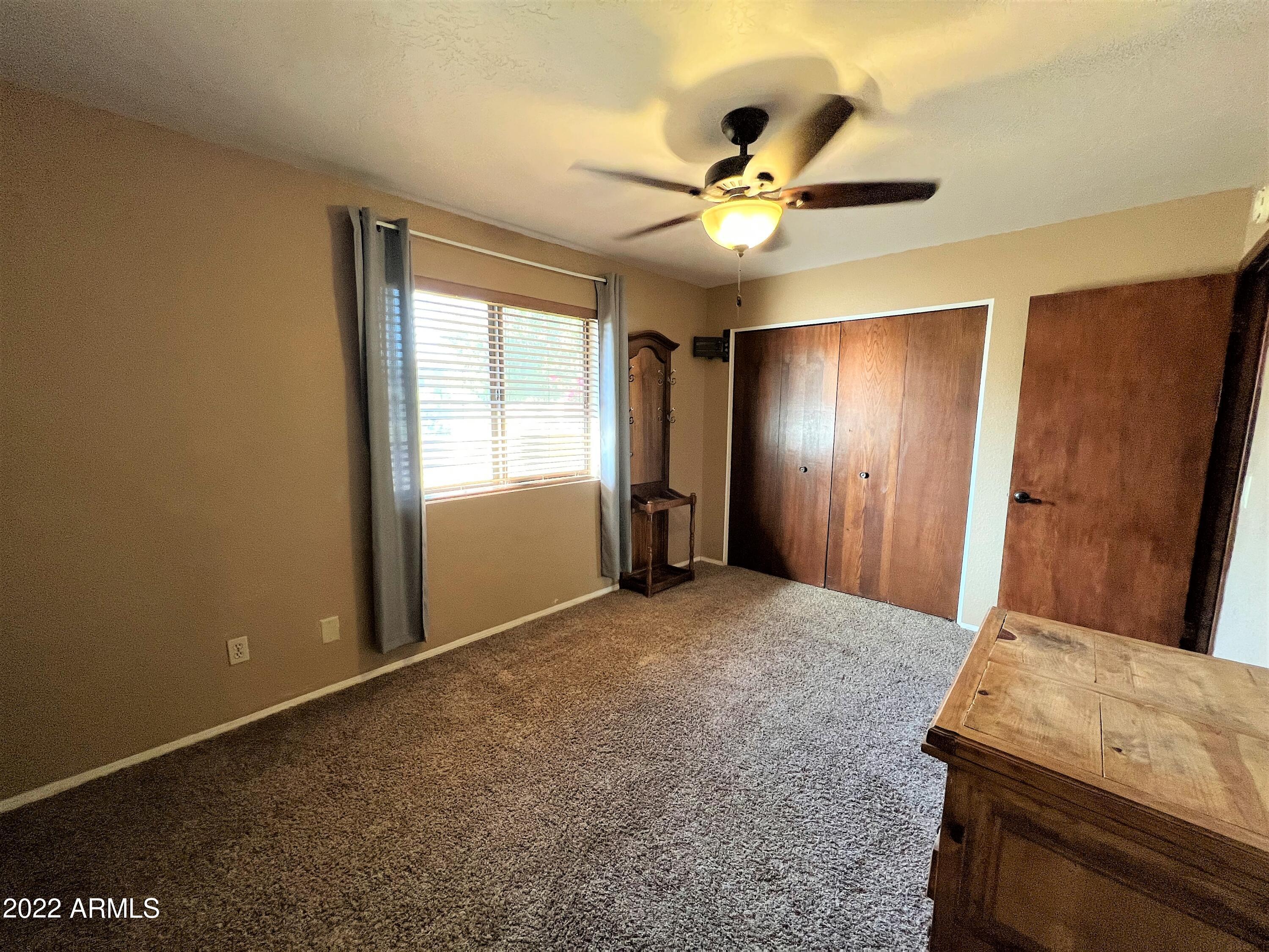 16502 West Magnolia Street Goodyear, AZ 85338 - Photo 34 of 59 a view of an empty room with a window