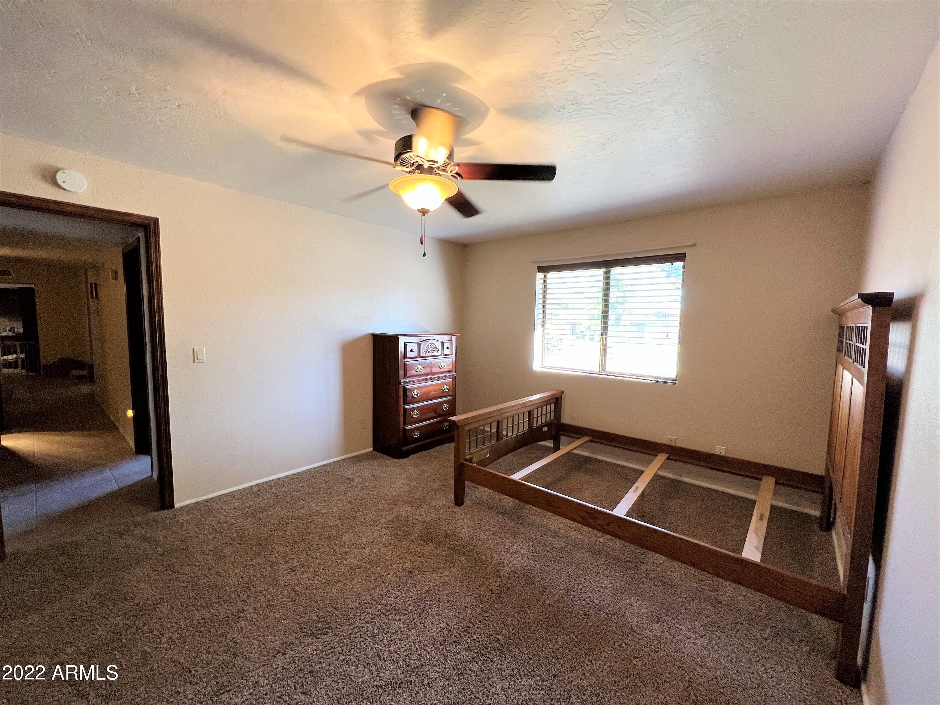 16502 West Magnolia Street Goodyear, AZ 85338 - Photo 36 of 59 a view of a room with gym equipment