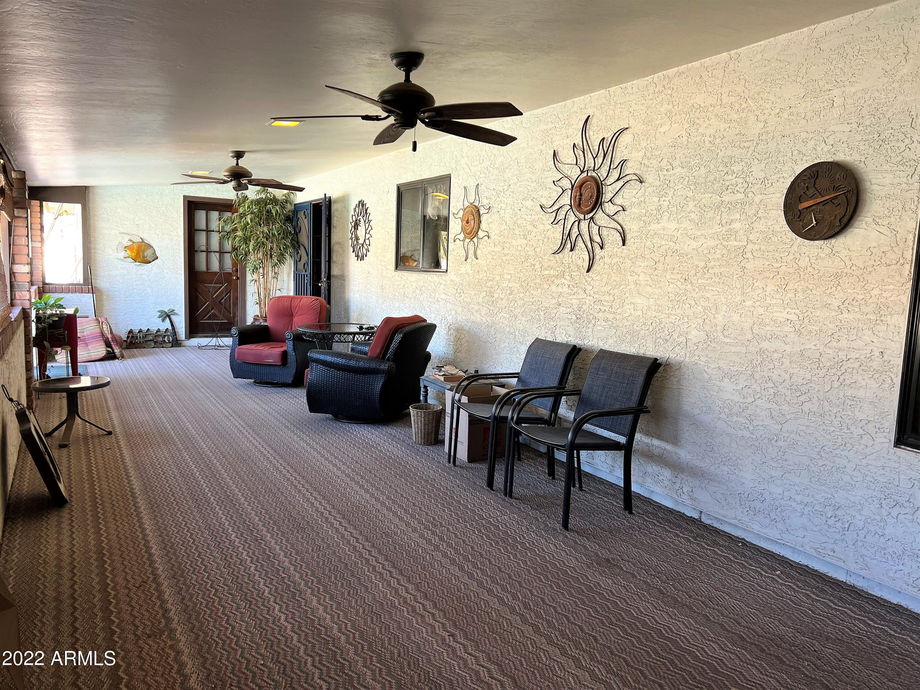 16502 West Magnolia Street Goodyear, AZ 85338 - Photo 43 of 59 a living room with furniture and a wooden floor