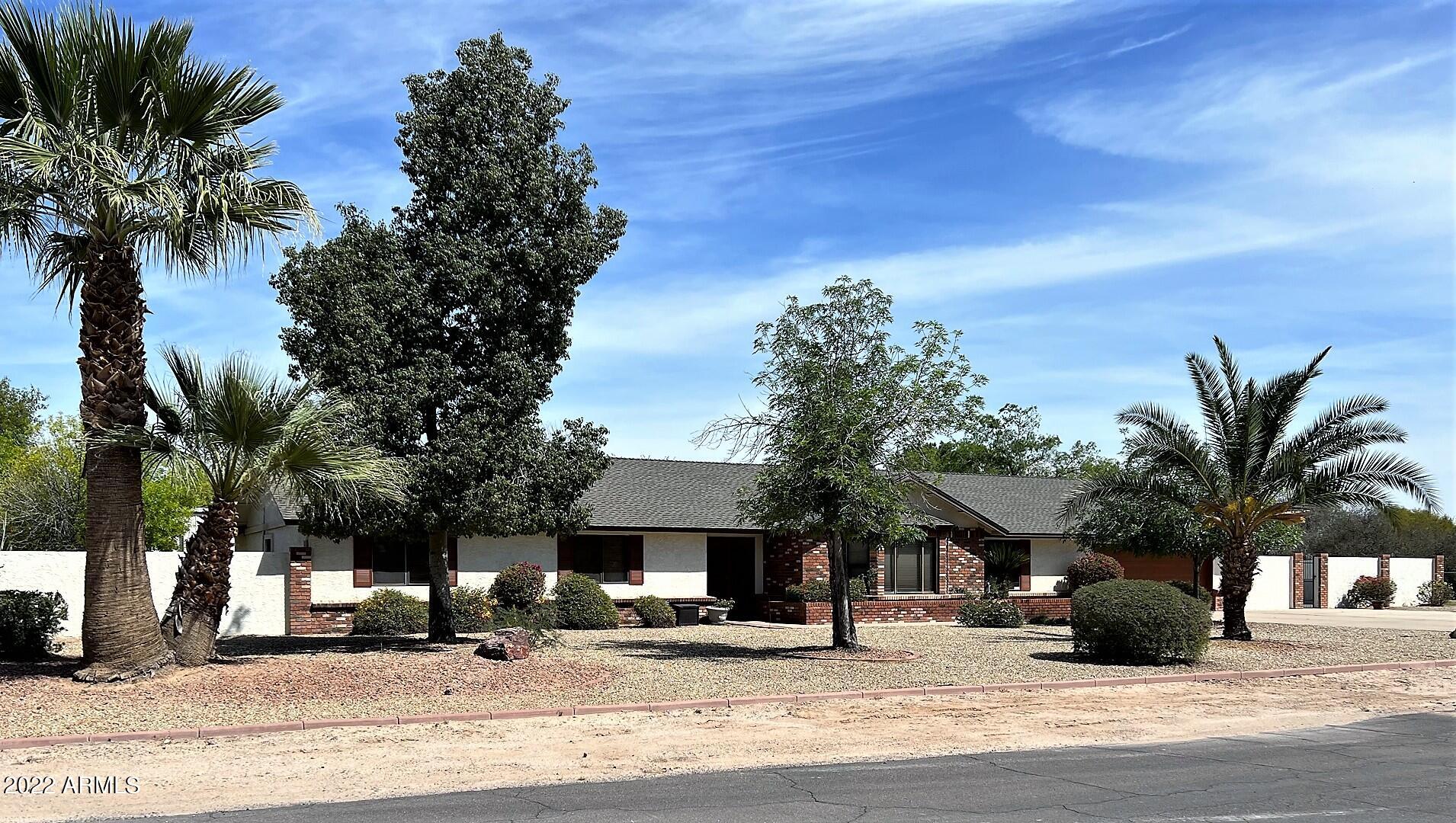 16502 West Magnolia Street Goodyear, AZ 85338 - Photo 57 of 59 a street view with palm trees