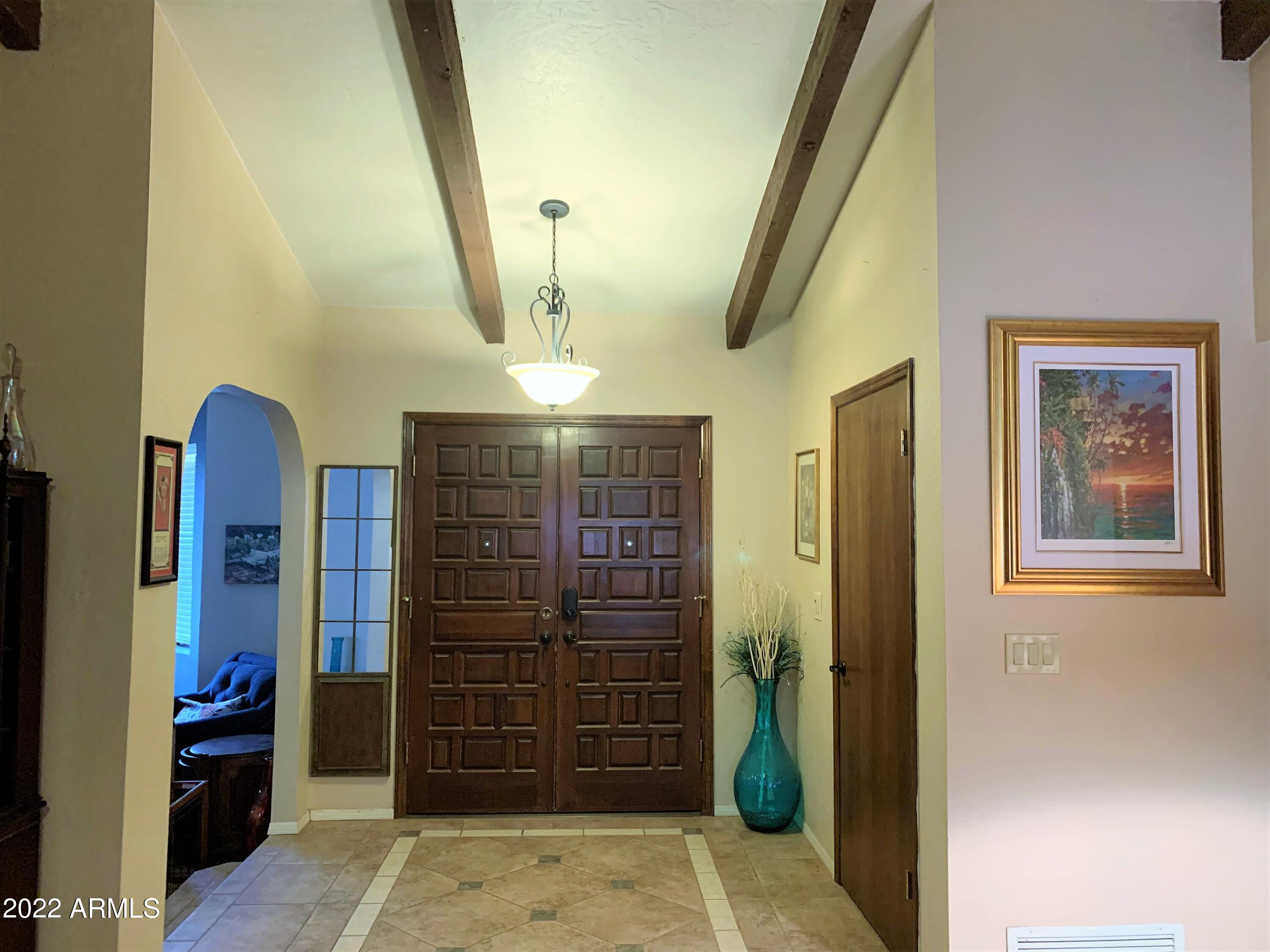 16502 West Magnolia Street Goodyear, AZ 85338 - Photo 10 of 59 a view of an entryway with a workspace