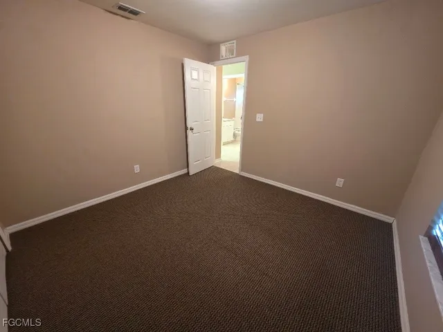 an empty room with a empty space and window