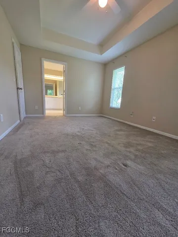 a view of an empty room with windows