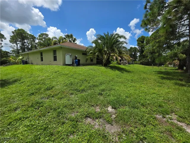 a view of a house with a garden