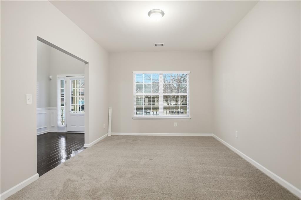 1021 Reddy Farm Lane Grayson, GA 30017 - Photo 11 of 22 an empty room with windows