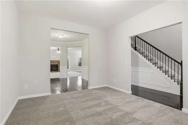 a view of entryway and hall with a front door