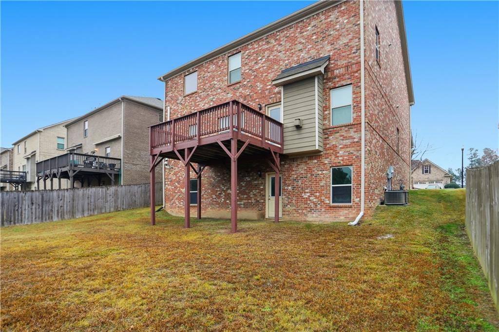 1021 Reddy Farm Lane Grayson, GA 30017 - Photo 21 of 22 a view of a house with a yard
