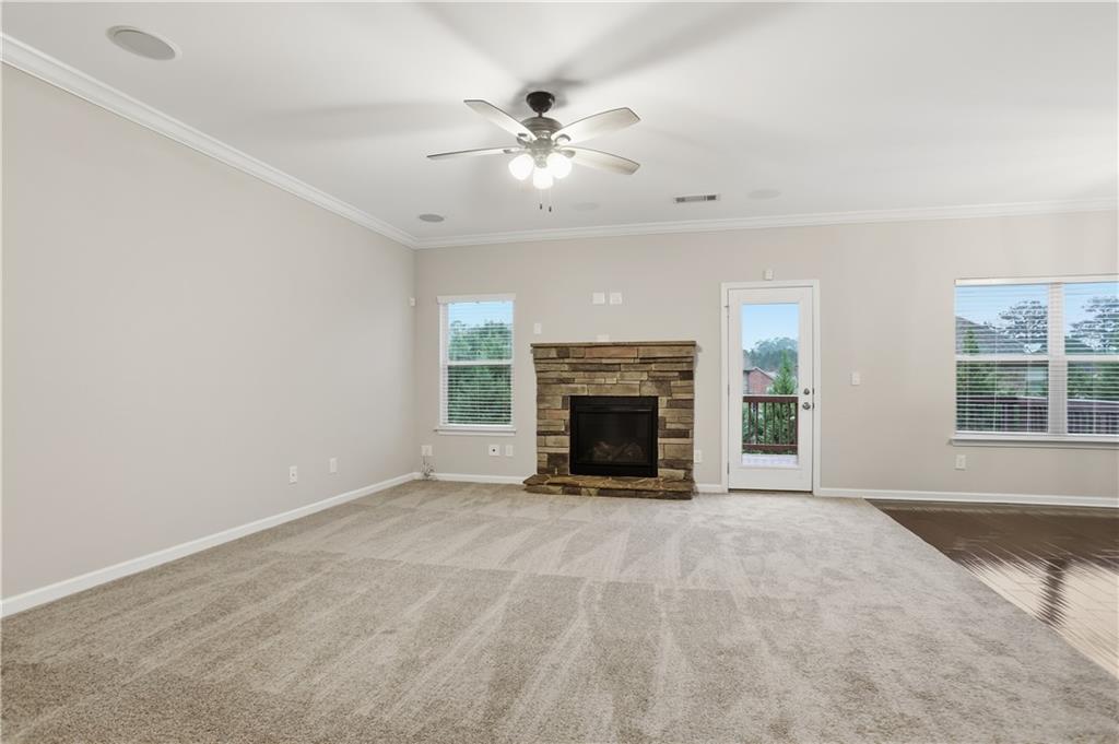 1021 Reddy Farm Lane Grayson, GA 30017 - Photo 4 of 22 a view of an empty room with window and fire place