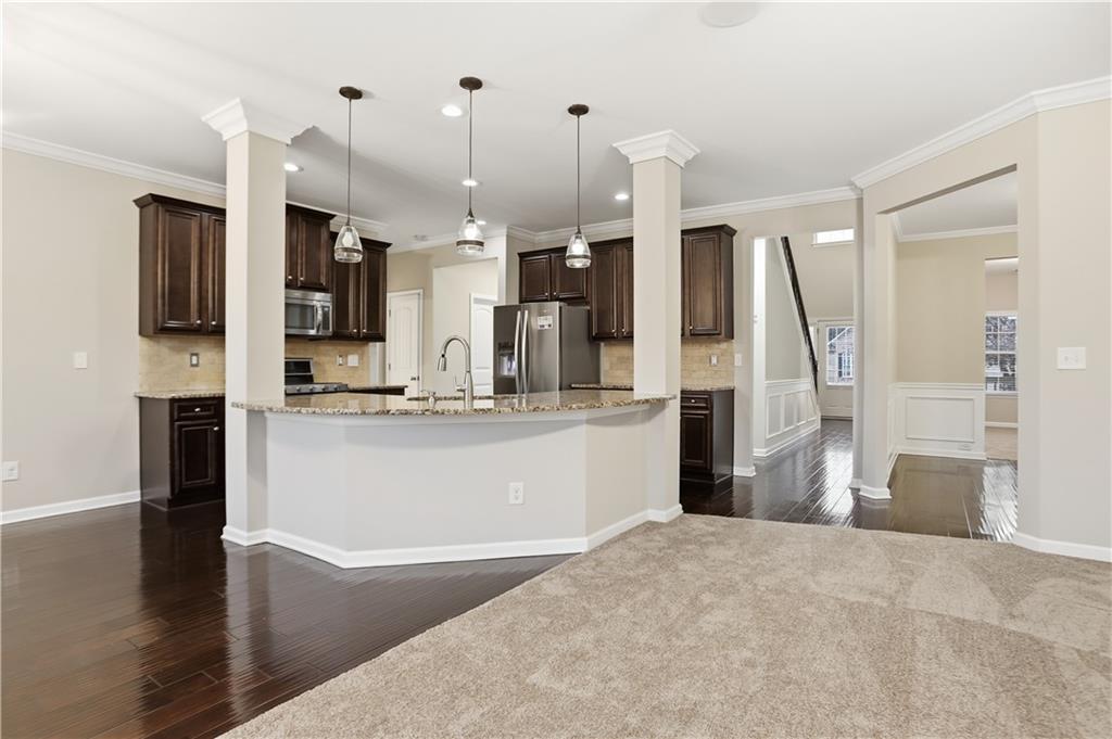 1021 Reddy Farm Lane Grayson, GA 30017 - Photo 5 of 22 a living room with stainless steel appliances kitchen island granite countertop furniture