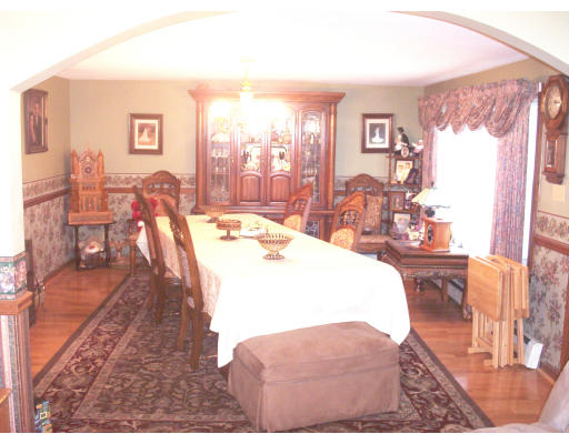 827 Guelphwood Road Southbridge, MA 01550 - Photo 3 of 30 a view of a dining room with furniture a chandelier and wooden floor
