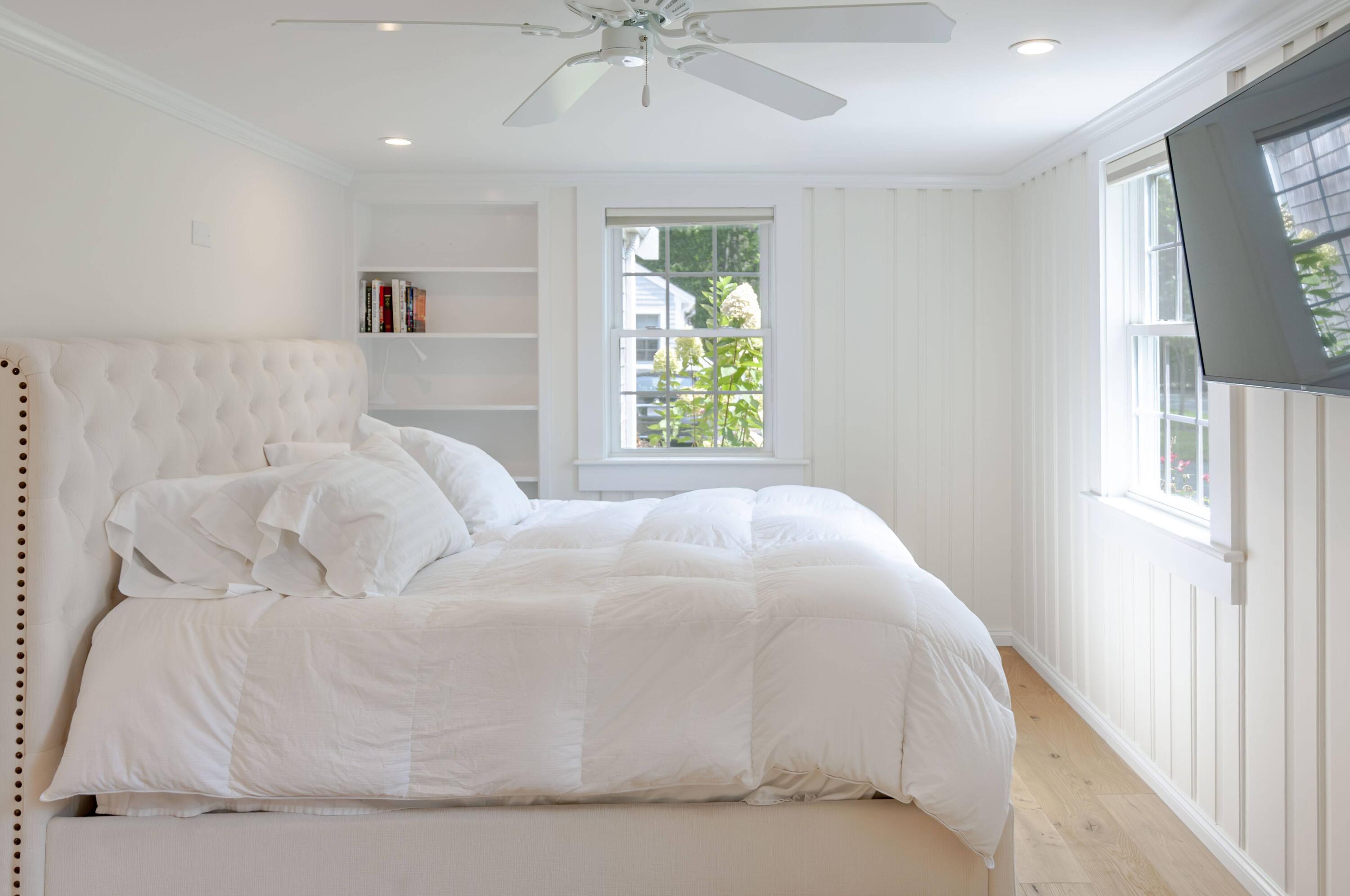 16 2nd Avenue, Unit 5A Osterville, MA 02655 - Photo 12 of 21 a large white bed in a white room