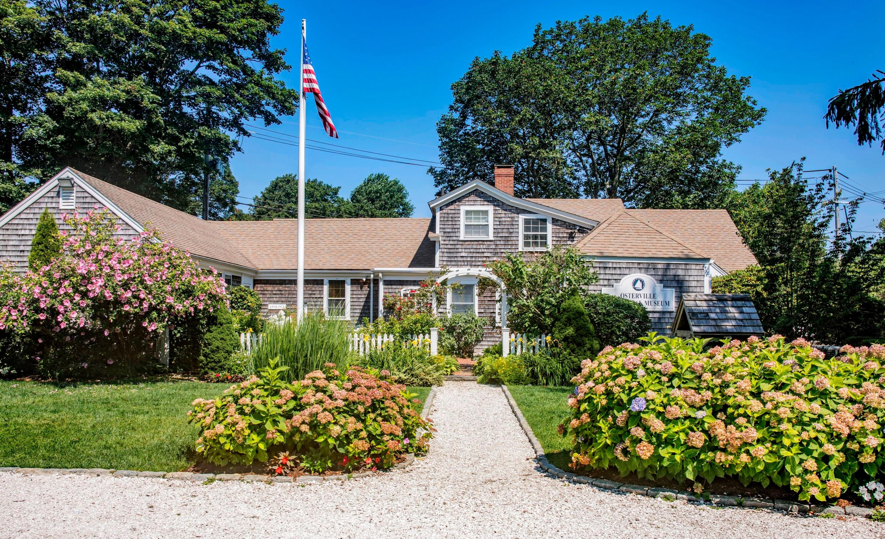 16 2nd Avenue, Unit 5A Osterville, MA 02655 - Photo 19 of 21 a front view of a house with a garden