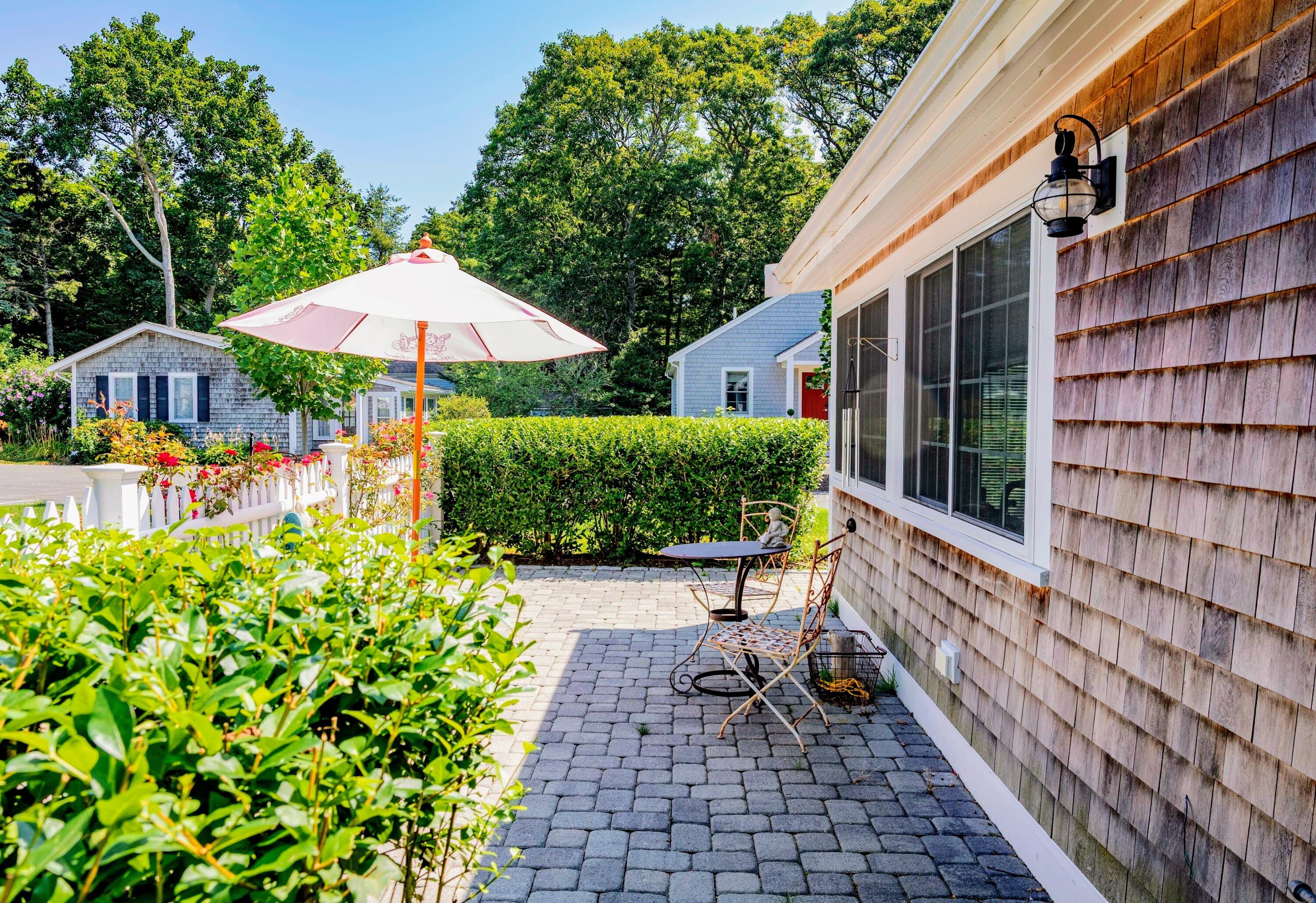 16 2nd Avenue, Unit 5A Osterville, MA 02655 - Photo 5 of 21 a view of a patio with chairs and plants