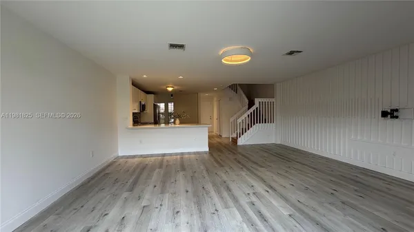 a view of a livingroom with wooden floor