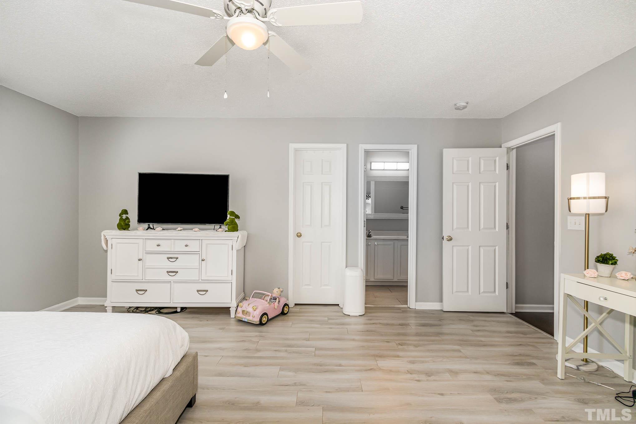 266 Inkster Cove Raleigh, NC 27603 - Photo 17 of 30 a view of bedroom with furniture and flat screen tv