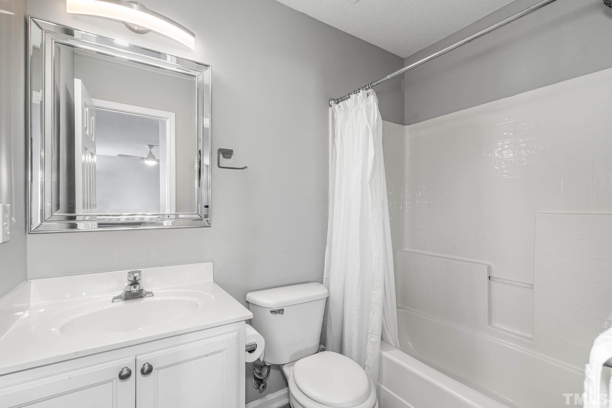 266 Inkster Cove Raleigh, NC 27603 - Photo 21 of 30 a bathroom with a sink toilet and shower