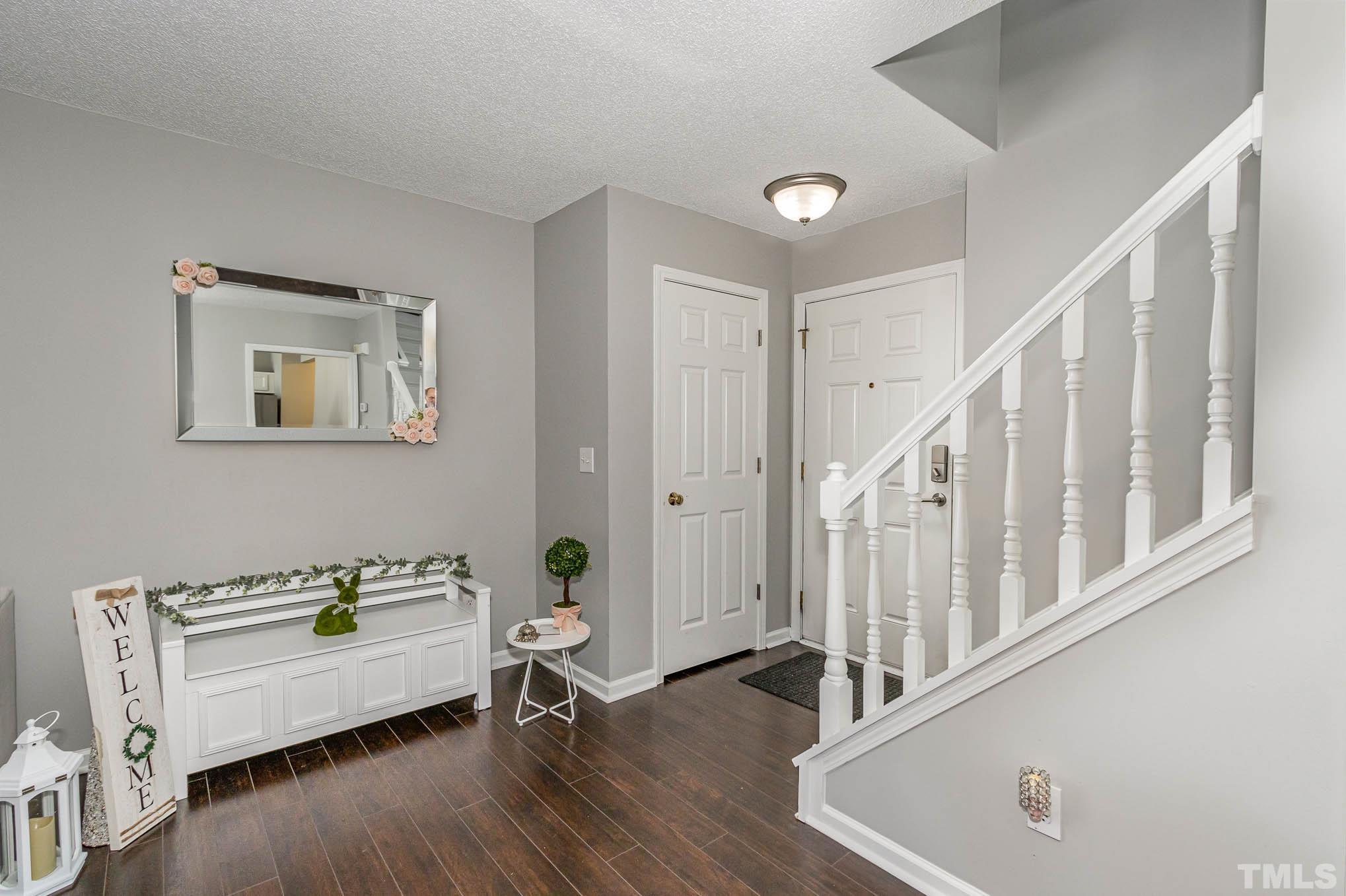 266 Inkster Cove Raleigh, NC 27603 - Photo 4 of 30 a living room with furniture and a wooden floor