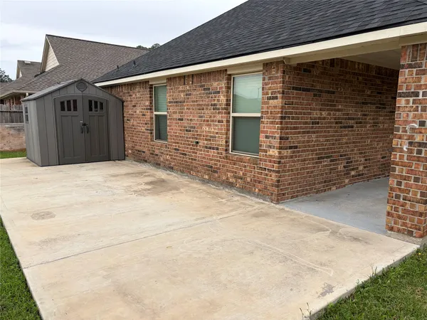 a bathroom with a granite countertop sink a mirror and a