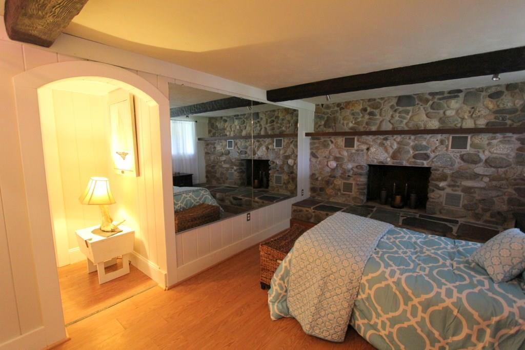 647 Wiswell Road Holden, ME 04429 - Photo 27 of 35 Bedroom with wood burning fireplace!