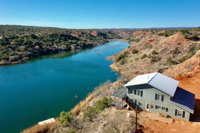 a view of a lake with a house