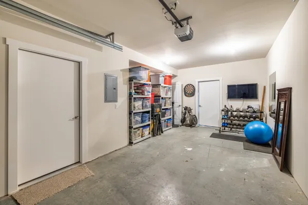 a view of a livingroom with furniture and a ceiling fan