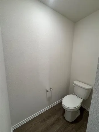 a white toilet sitting next to a white sink