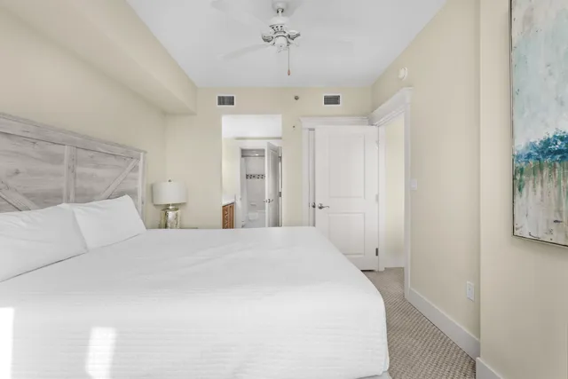 a bedroom with a bed and a night stand