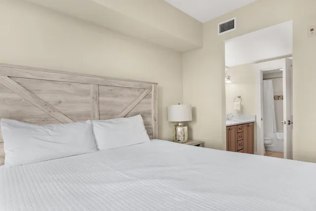 a bathroom with a sink double vanity granite tub and a mirror