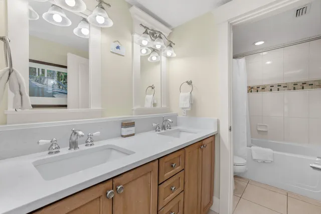 a bathroom with a sink vanity and a mirror