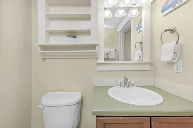 a view of a balcony with wooden floor and fence
