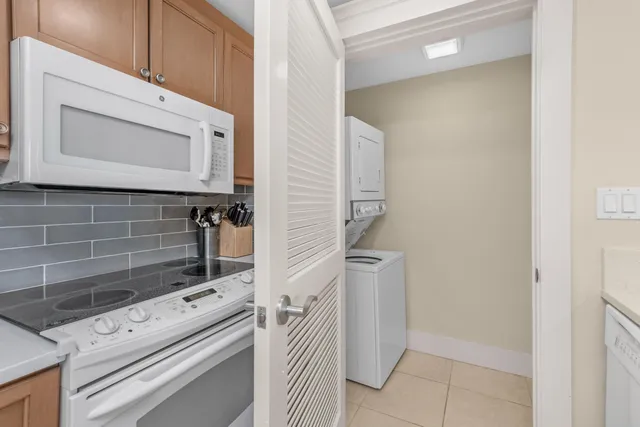 a white refrigerator freezer sitting inside of a kitchen