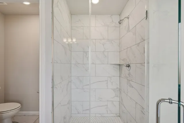 a spacious bathroom with a double vanity sink mirror and double