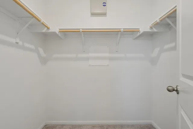 a spacious bathroom with a tub sink and mirror