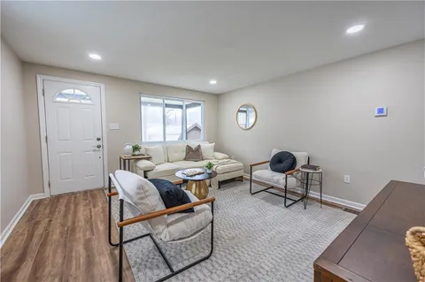 an empty room with wooden floor