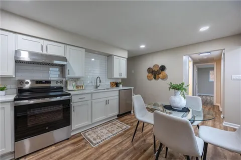 a view of room with window and hardwood floor