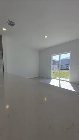 a kitchen with stainless steel appliances granite countertop a sink a stove a microwave and cabinets