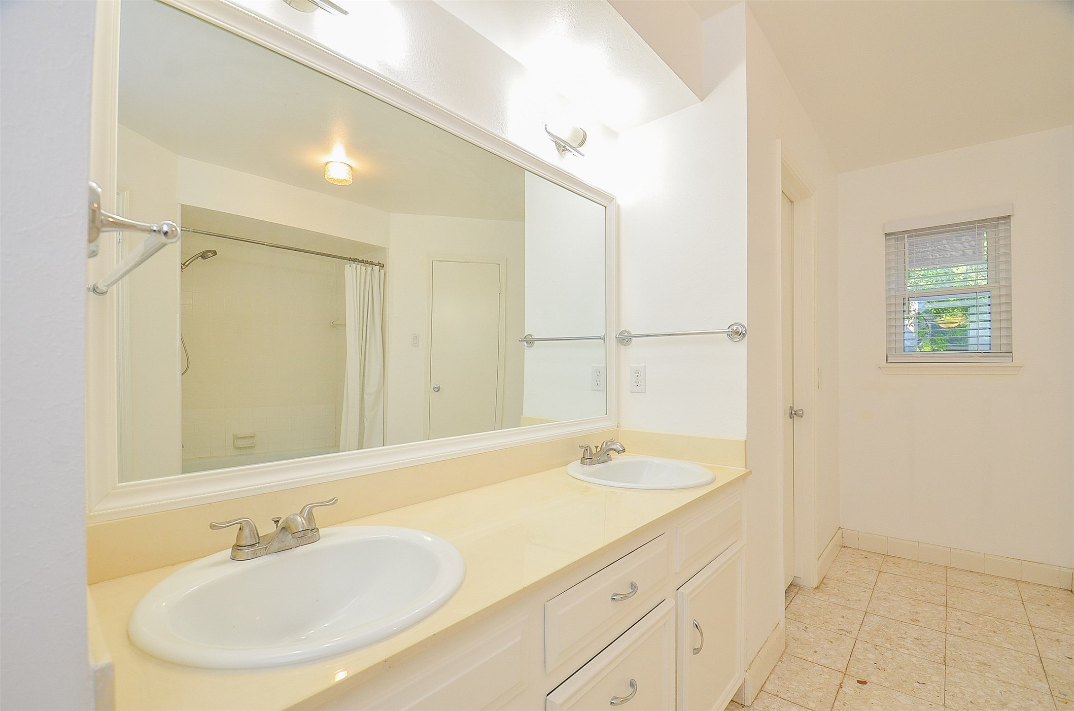 710 South Fry Road Katy, TX 77450 - Photo 48 of 50 Crafted huge mirror frame over double sinks and yard view window in master bathroom.