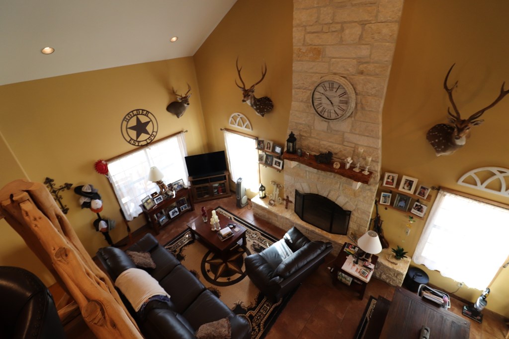 5-6 SD 45125 Rocksprings, TX 78880 - Photo 24 of 28 a living room with furniture and a fireplace